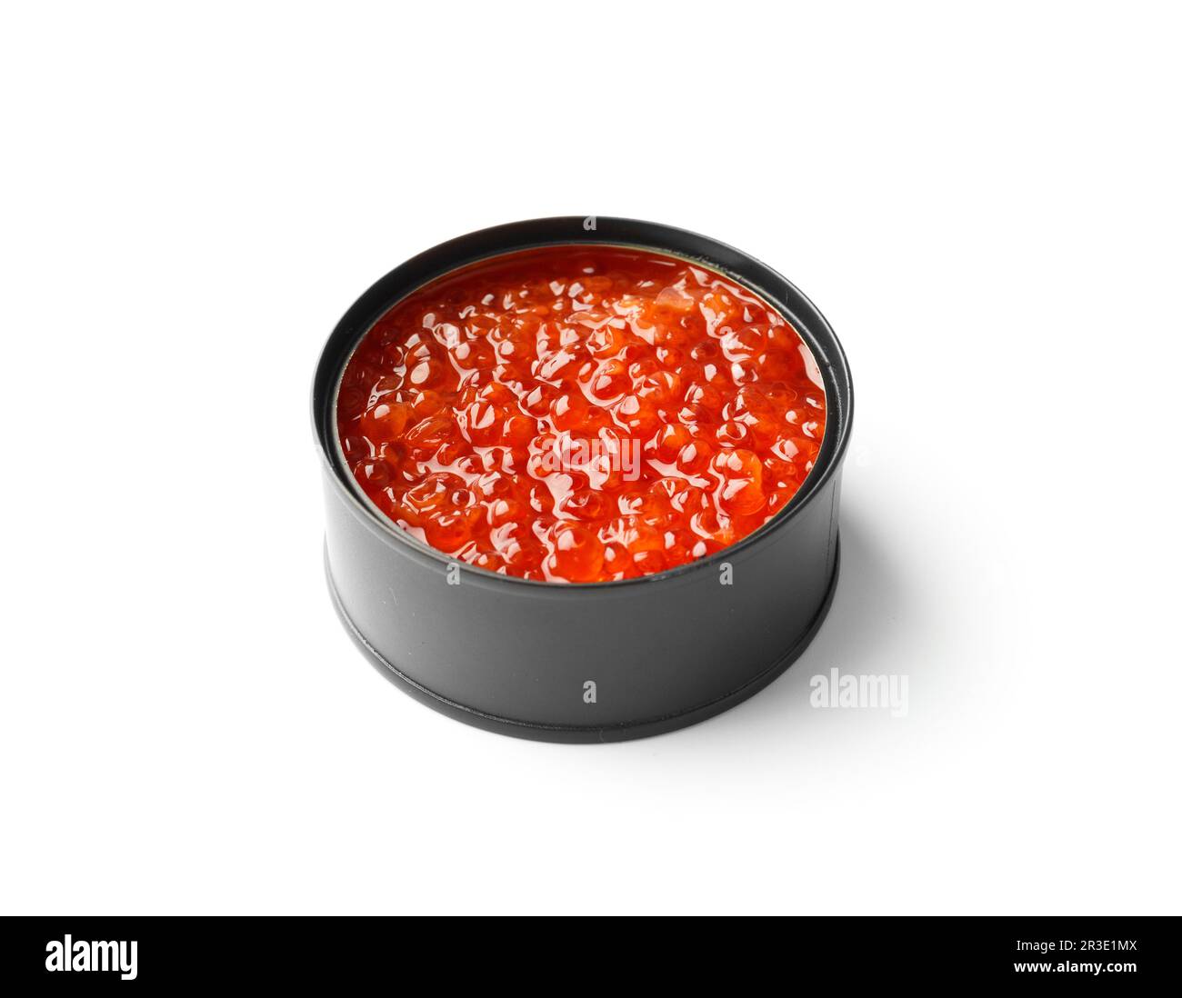 Red salmon caviar in an open black tin can on a white background. Useful delicacy seafood, canned fish. Stock Photo