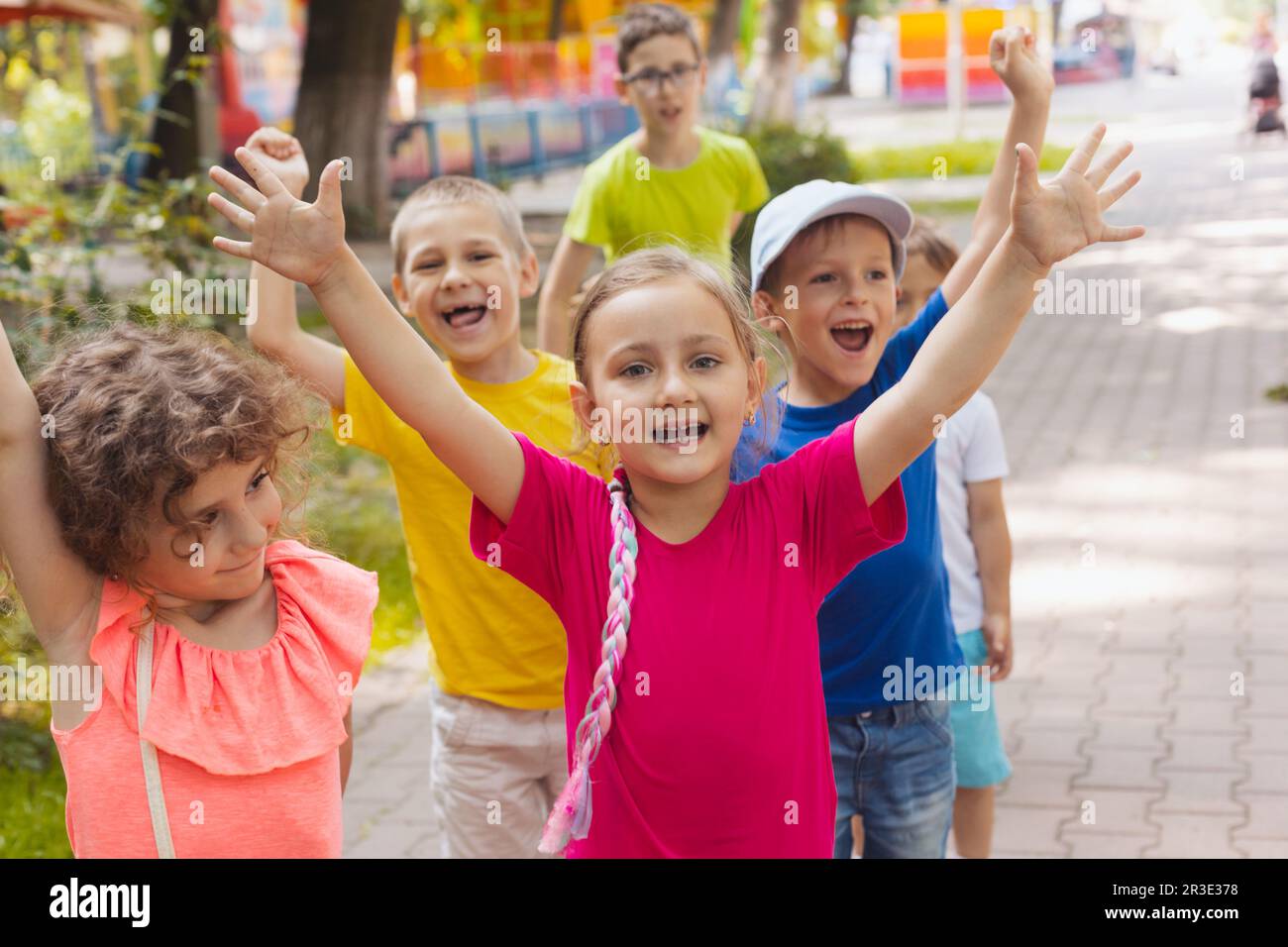 Cheerful emotional children having fun time outdoors Stock Photo