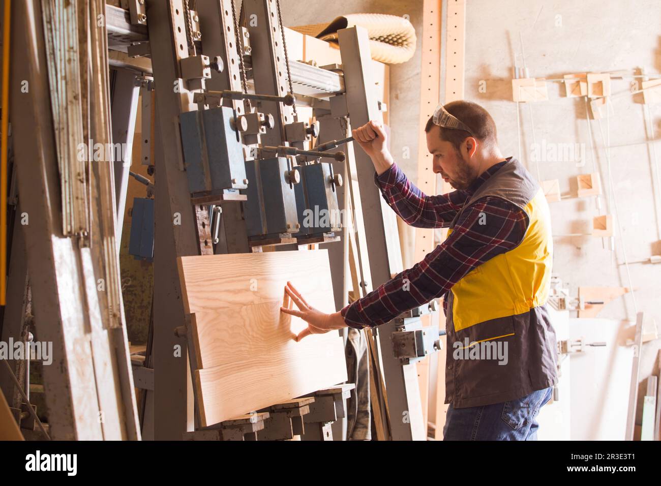 Process of making furniture with help of manual press Stock Photo Alamy