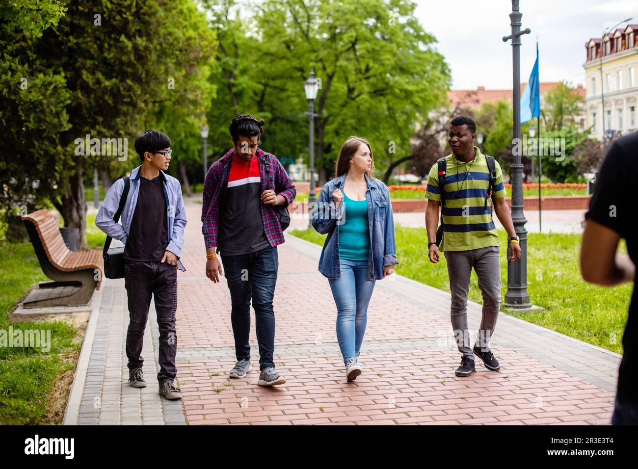 Multicultural friendship concept. Young people walking together Stock Photo