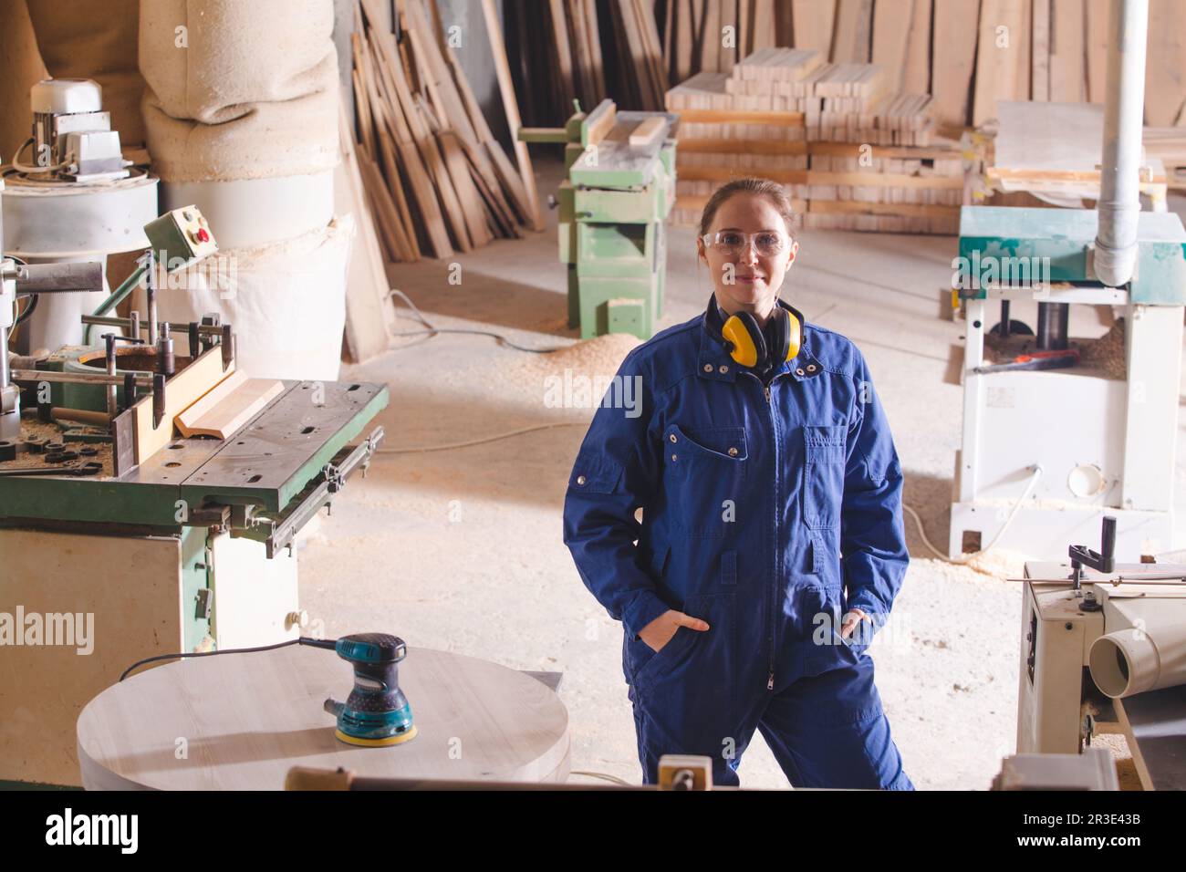 Young girl experienced professional at woodworking factory Stock Photo