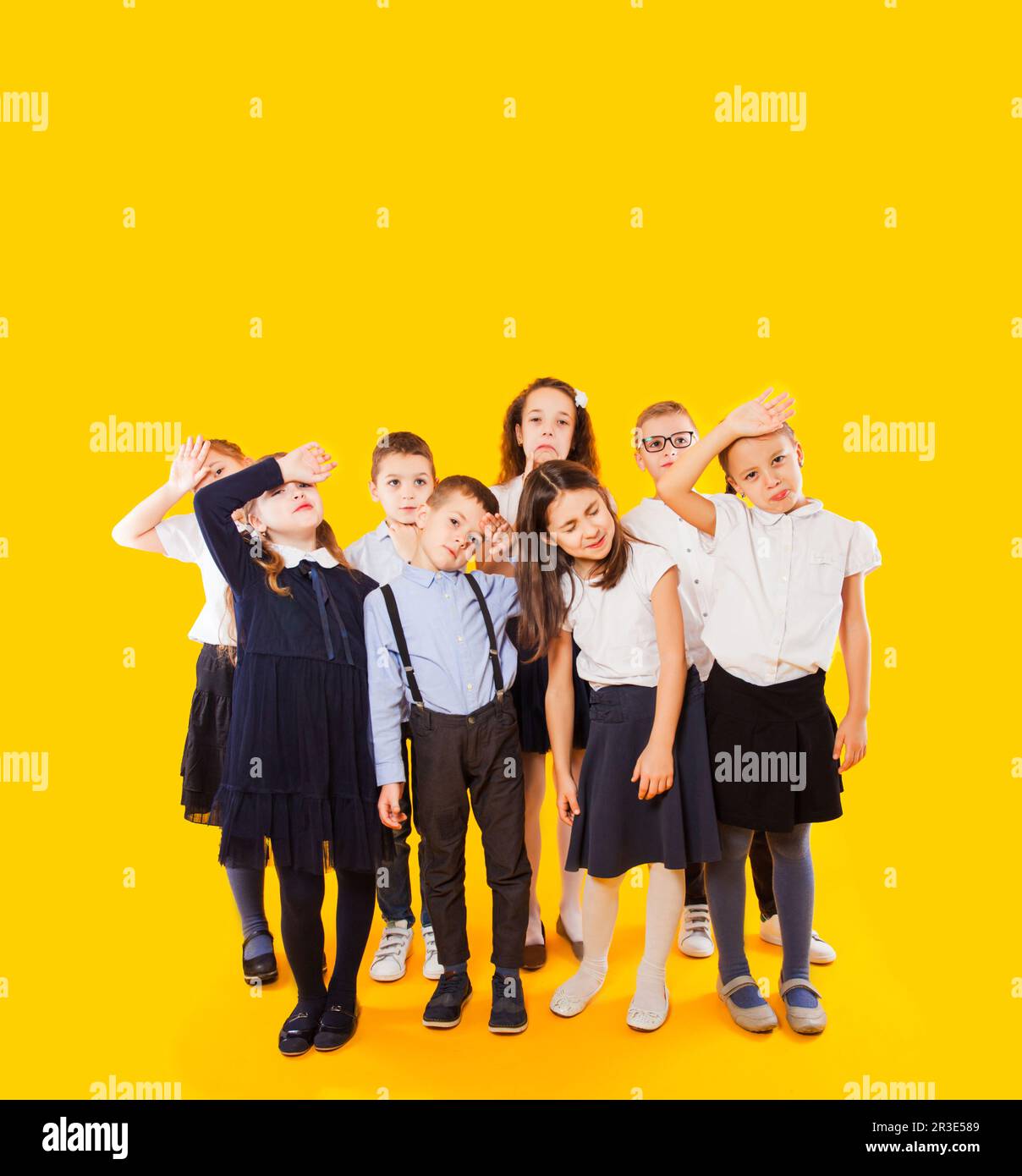 Group of demotivated schoolchildren are standing together Stock Photo ...