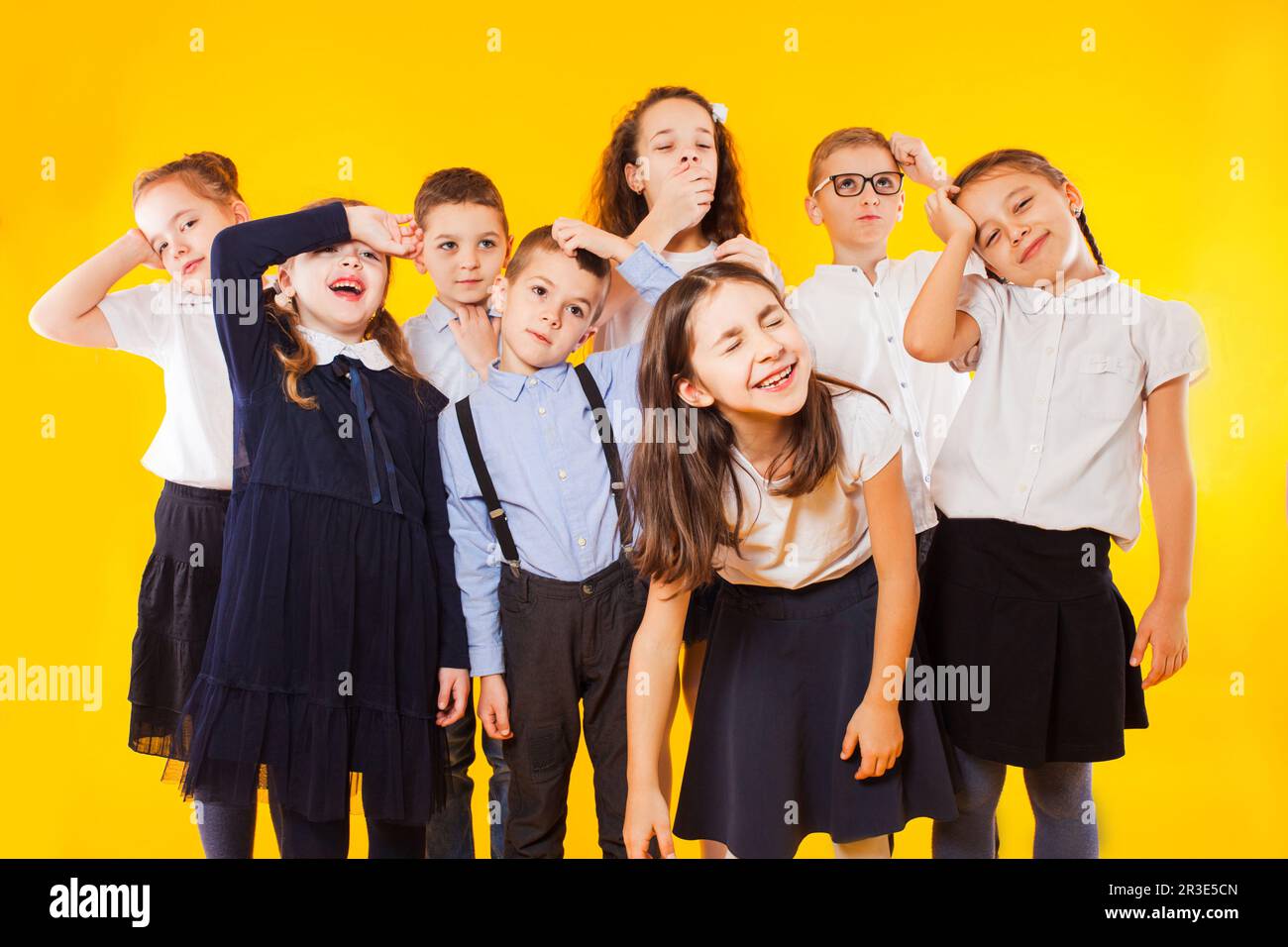 Group of demotivated schoolchildren are standing together Stock Photo ...