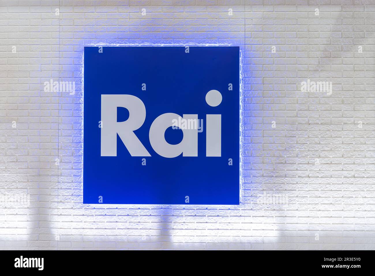 Turin, Italy - May 22, 2023: Logo of RAI Radio Televisione Italiana on sign on white brick wall. RAI is broadcasting company of Italy Stock Photo