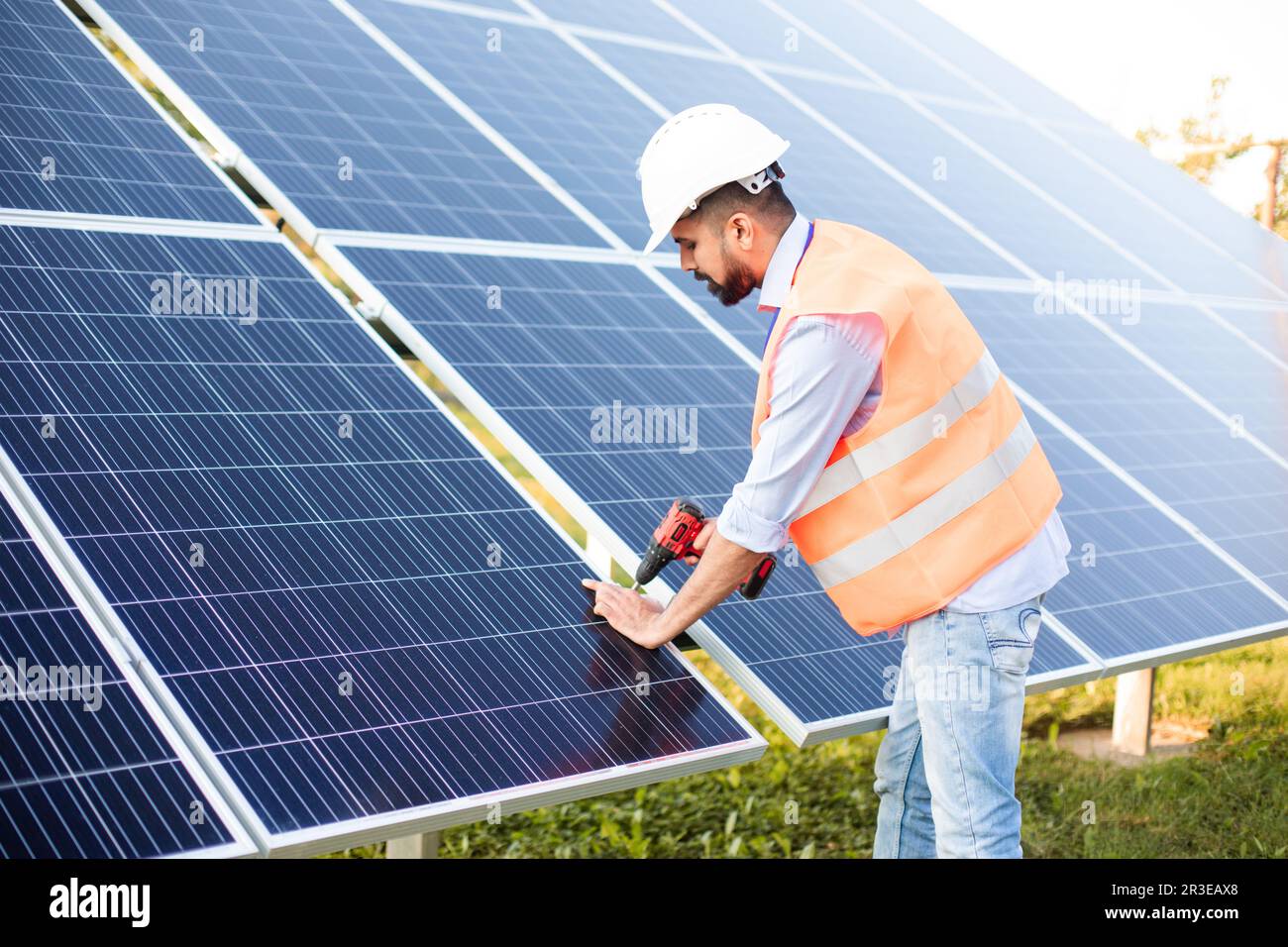 The young electrician works at a solar station Stock Photo Alamy