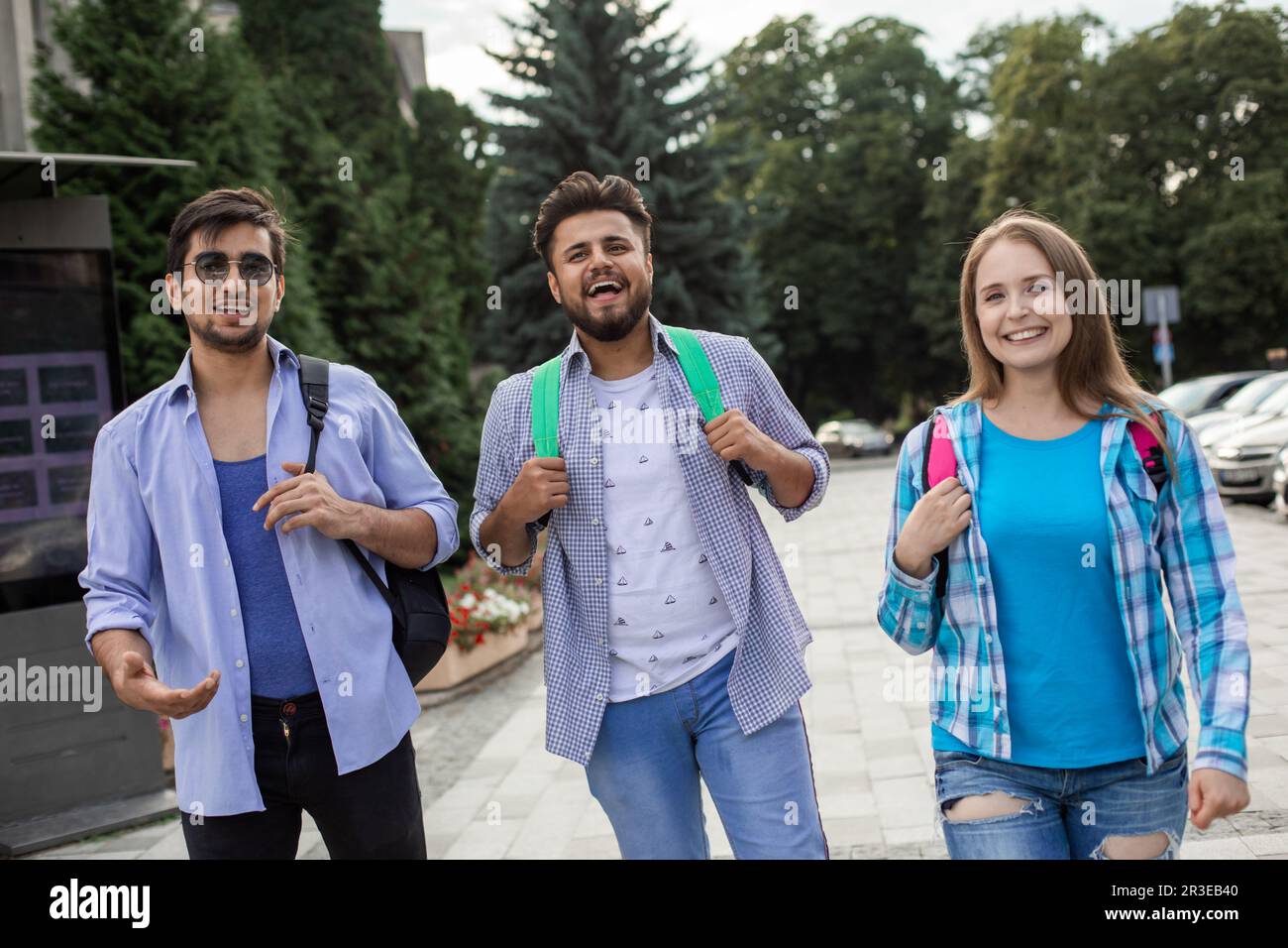 Group of high school students talking and laughing Stock Photo