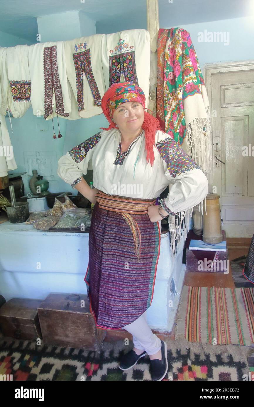 The photo was taken in one of the villages of Transcarpathia in Ukraine. The picture shows a young woman in national dress. The interior of the nation Stock Photo