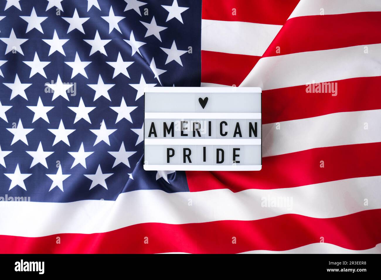 American flag. Lightbox with text AMERICAN PRIDE Flag of the united