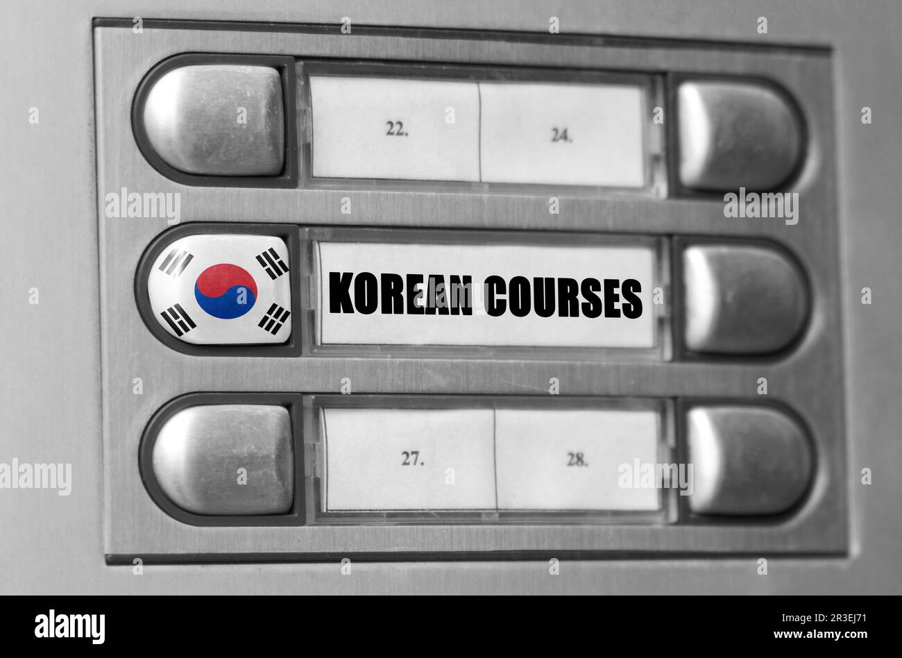 On the intercom there is a button with the flag of South Korea and the inscription - Korean language courses. Stock Photo
