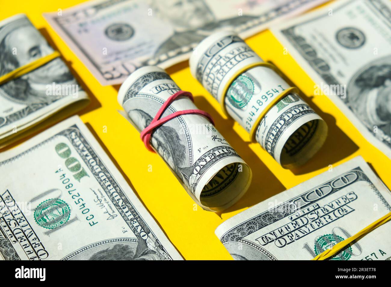 US dollars bundle close up isolated on dollar background. Paper