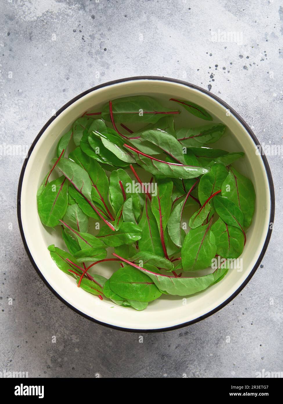 Red chard in a cold ice water. Healthy Meal recipe preparation. Plant