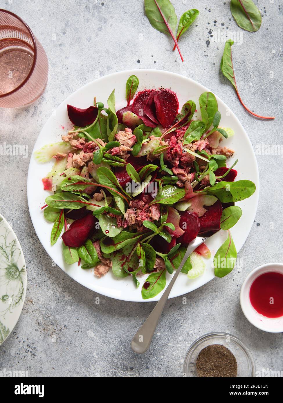 Healthy fresh salad. Beetroot, red chard and canned tuna salad. Healthy Meal recipe preparation. Plant-based dishes. Green livin Stock Photo