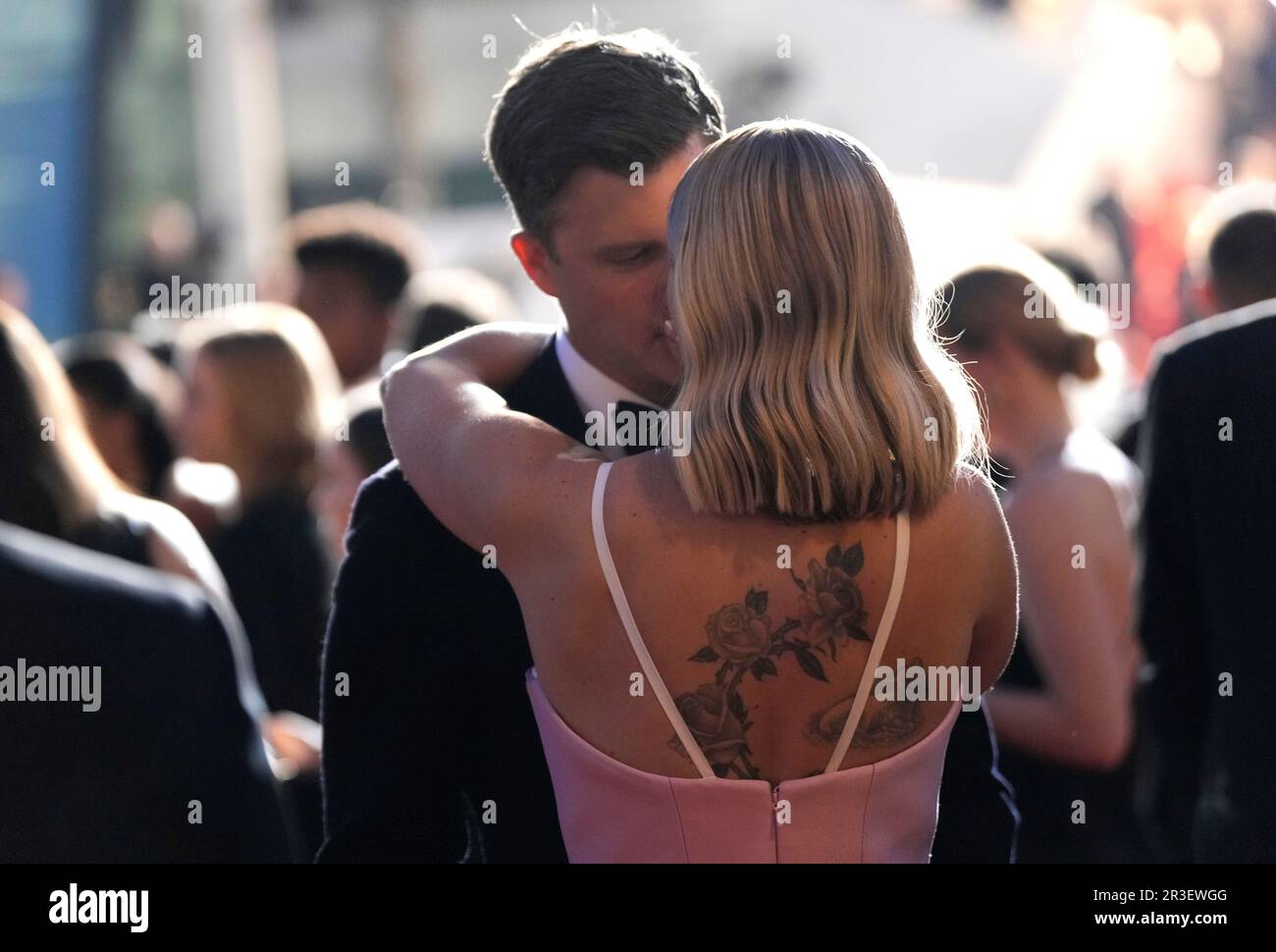 Colin Jost, left, and Scarlett Johansson kiss upon departing the