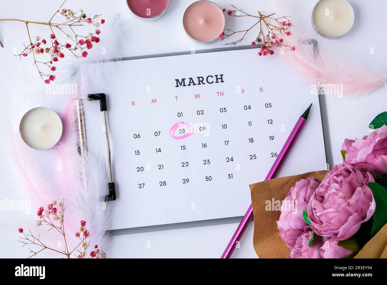 Calendar 8th of March. Happy womans day. Day in calendar. Flowers candles. Female Stock Photo