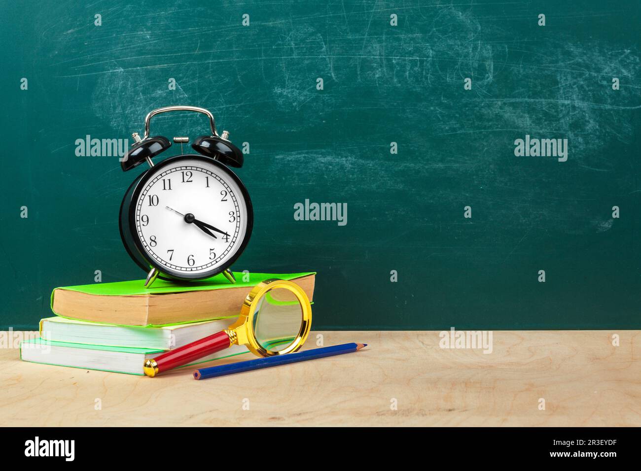 School supplies. Writing utensils and alarm clock. Time to study ...
