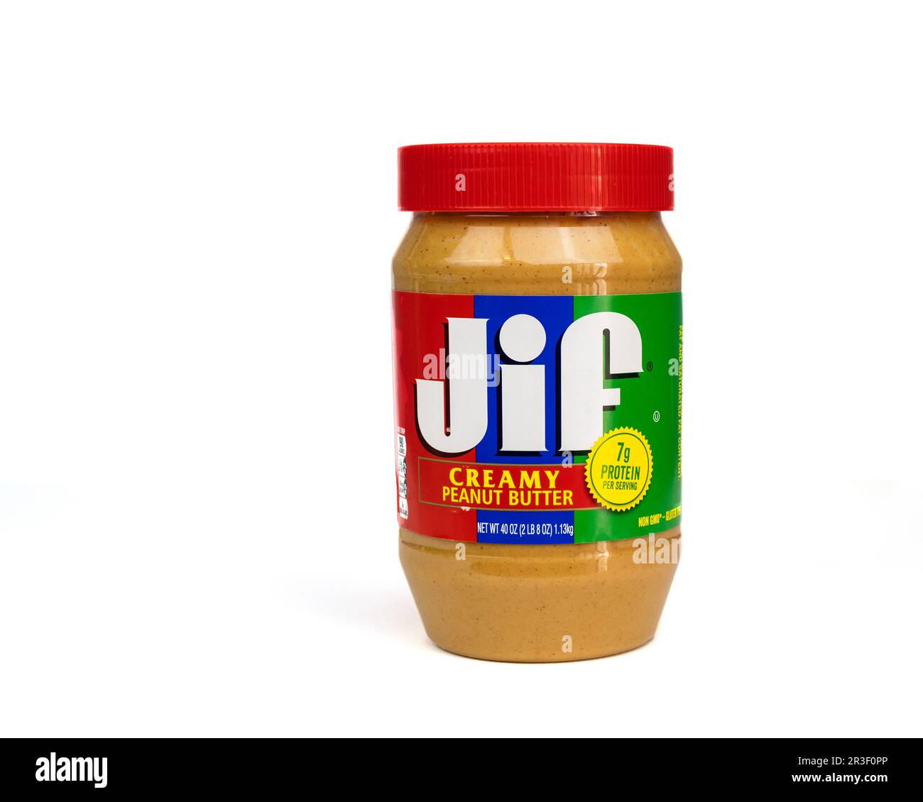 Jar of Jif brand creamy peanut butter on a white background, USA. Stock Photo