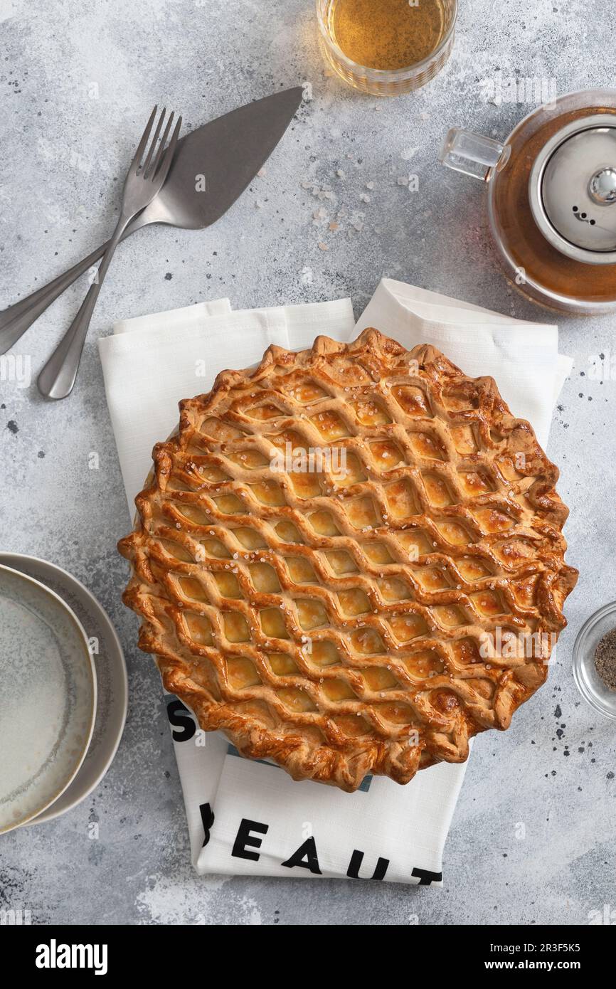 English meat pie. Pork pie. Traditional British pie. Freshly baked homemade savory pies with golden crust. Pie with pastry decor Stock Photo