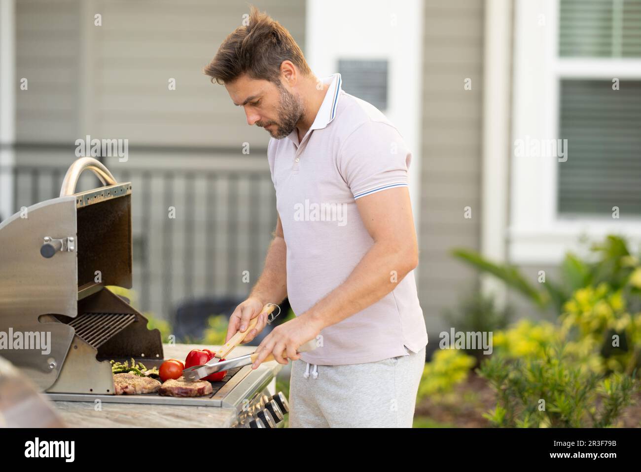 Grill chef cook. Guy with BBQ cooking tools. Barbecue and grill. Picnic and  barbecue party. Chief cook with utensils for barbecue grill. Barbeque on  Stock Photo - Alamy