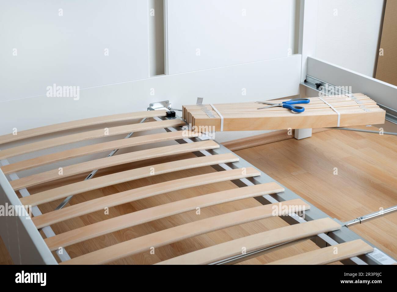 The furniture assembler assembles the bed frame, do it yourself and