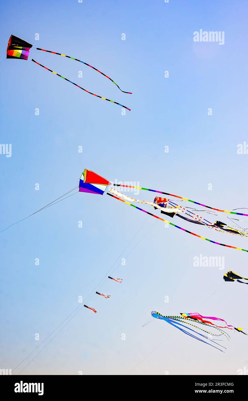 Colorful kites fly over the beach, May 13, 2023, in Long Beach, Mississippi. Long Beach is a seaside town located on the Mississippi Gulf Coast. Stock Photo