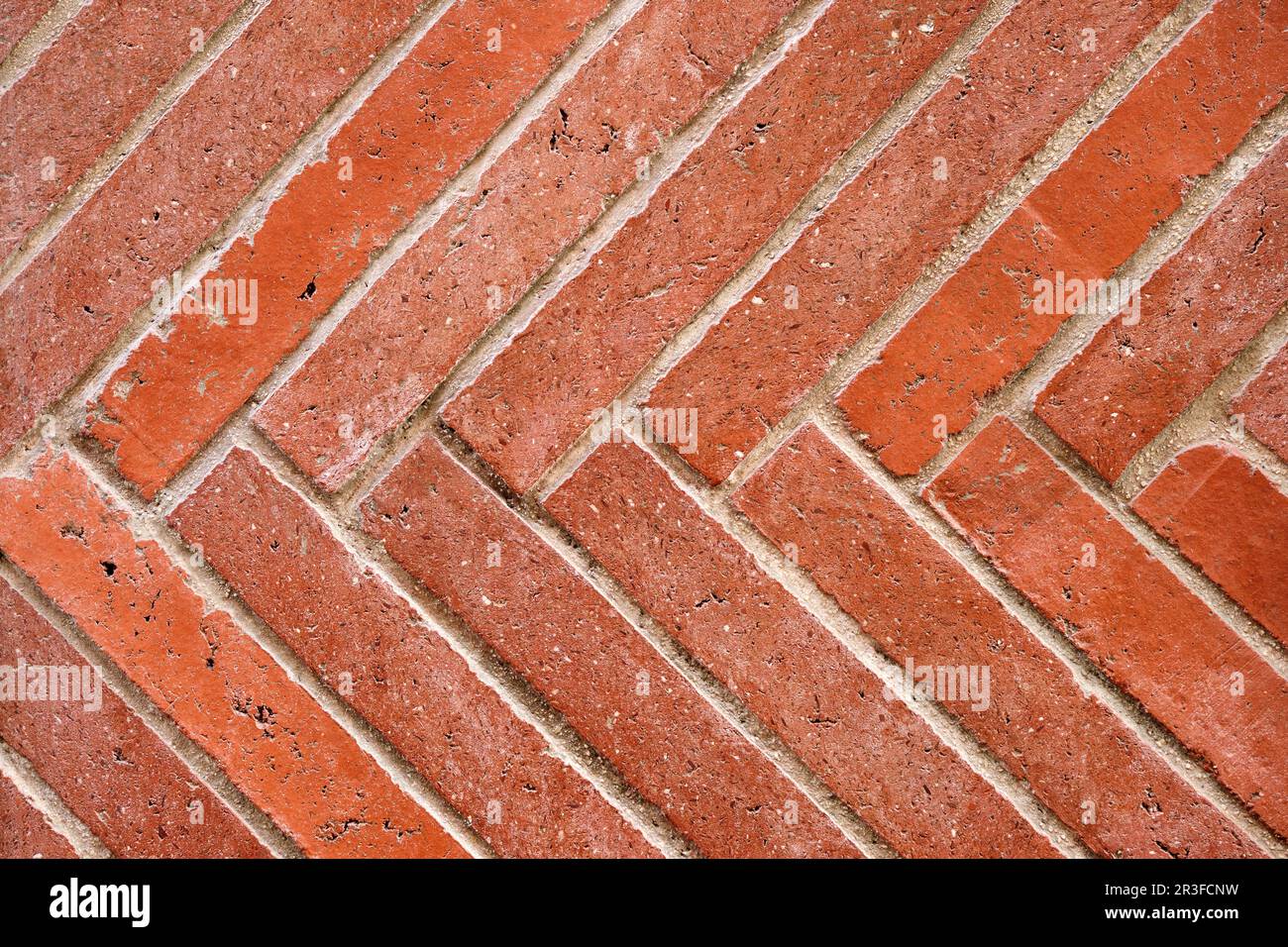 Background from a wall made of diagonal red clinker bricks Stock Photo