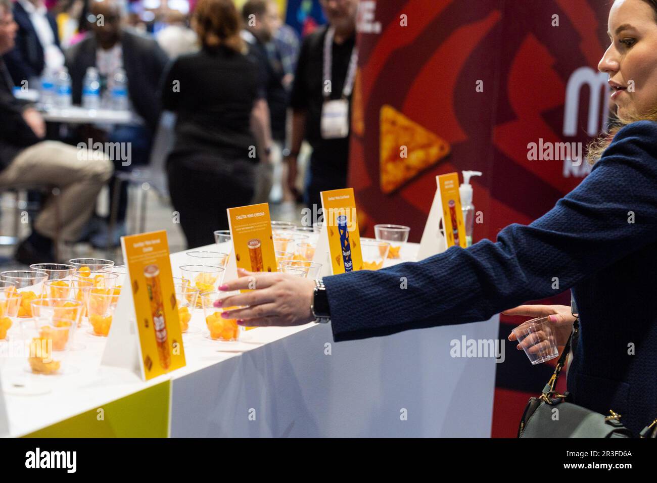 Chicago, USA. 23rd May, 2023. An attendee takes a sample at a booth at