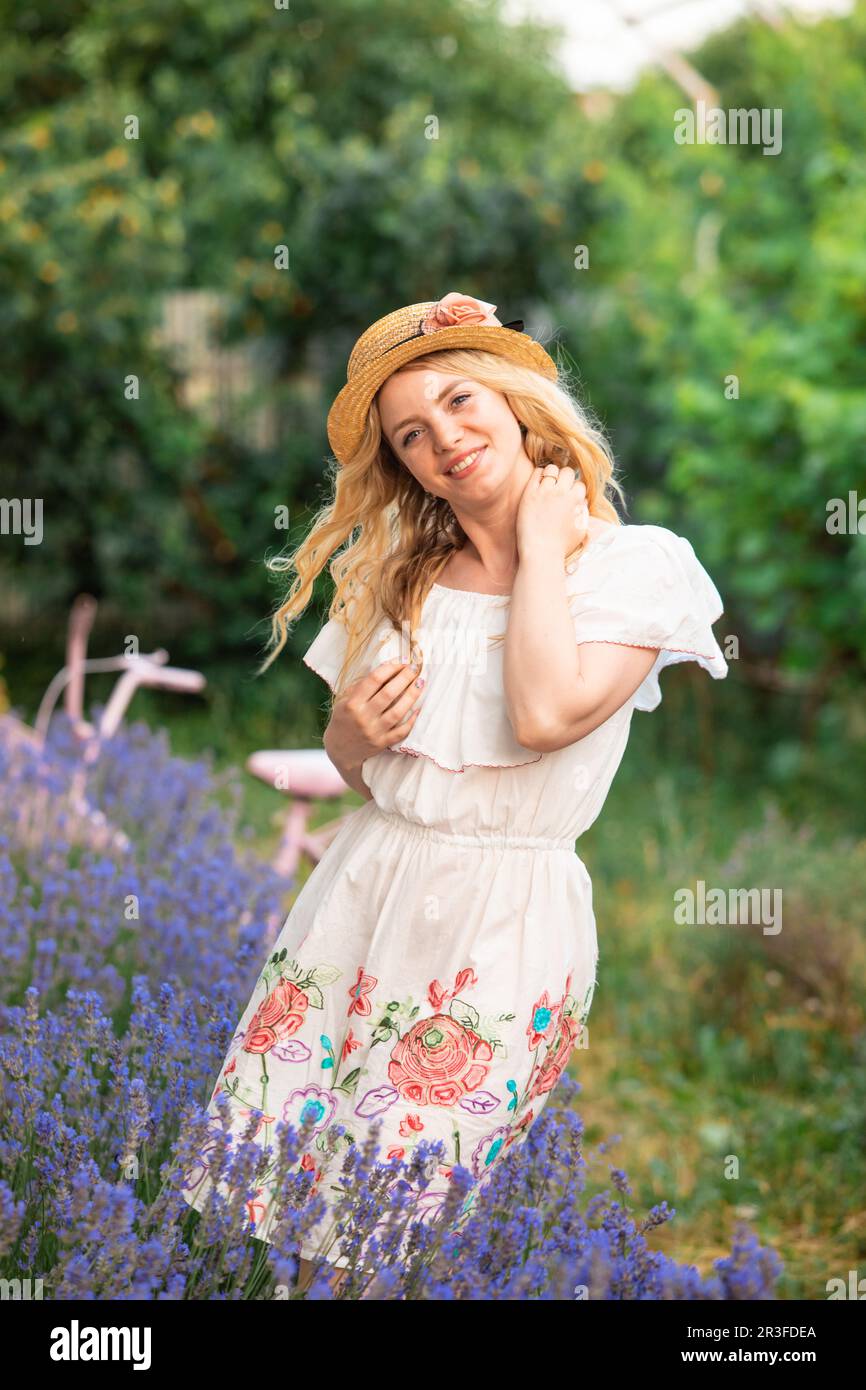 beautiful-blonde-girl-in-the-hat-near-lavender-bushes-stock-photo-alamy