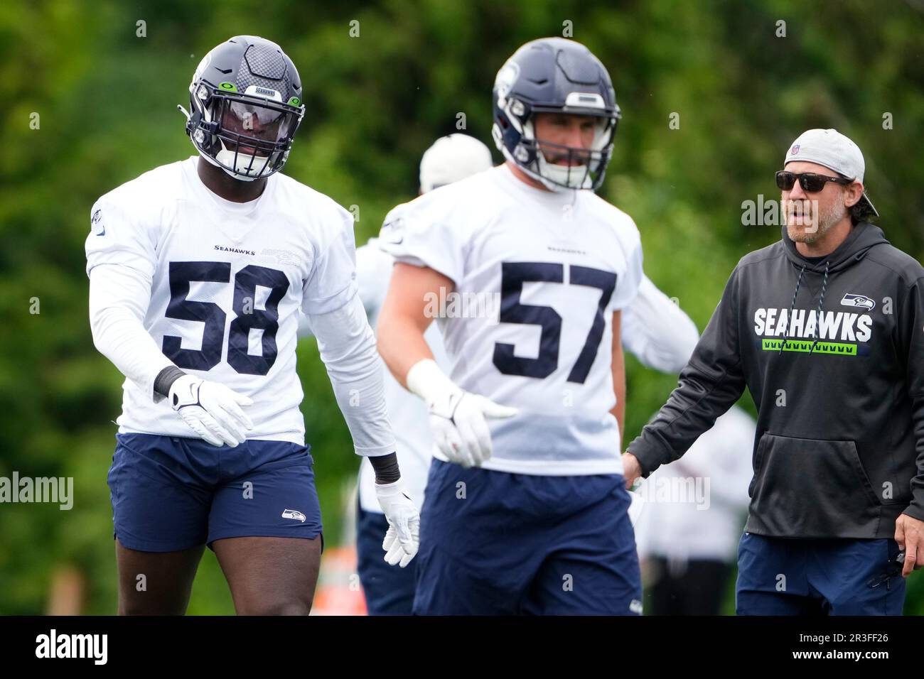 Seattle Seahawks linebacker Patrick O'Connell (57) carries the ball during  a Back Together Weekend event at the NFL football team's training  facility, Sunday, July 30, 2023, in Renton, Wash. (AP Photo/Lindsey Wasson