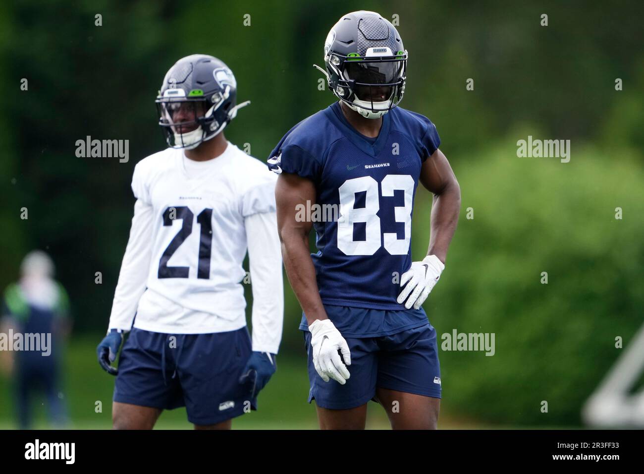 Seattle Seahawks cornerback Devon Witherspoon (21) and wide receiver