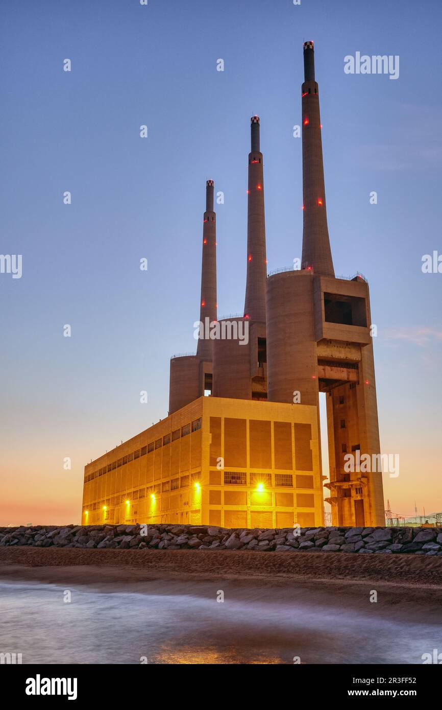 The decommissioned thermal power station at Sant Adria near Barcelona at twilight Stock Photo