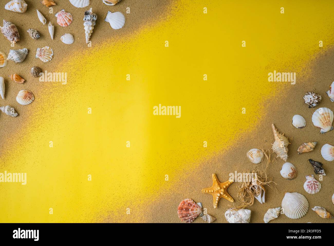 Composition frame for copy space, seashells, pebbles, mockup on yellow sand background. Blank, top view, still life, flat lay. s Stock Photo