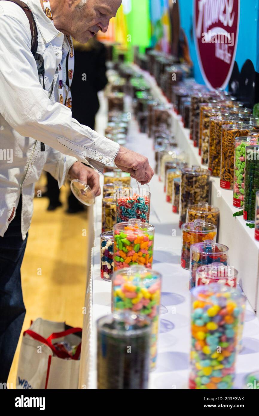 Chicago, USA. 23rd May, 2023. An attendee samples candies at a booth at