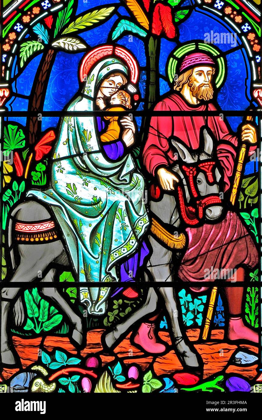 Flight to Egypt, Joseph, Mary, baby Jesus, escape slaughter of new born males, stained glass window, by Frederick Preedy, 1865, Gunthorpe, Norfolk Stock Photo