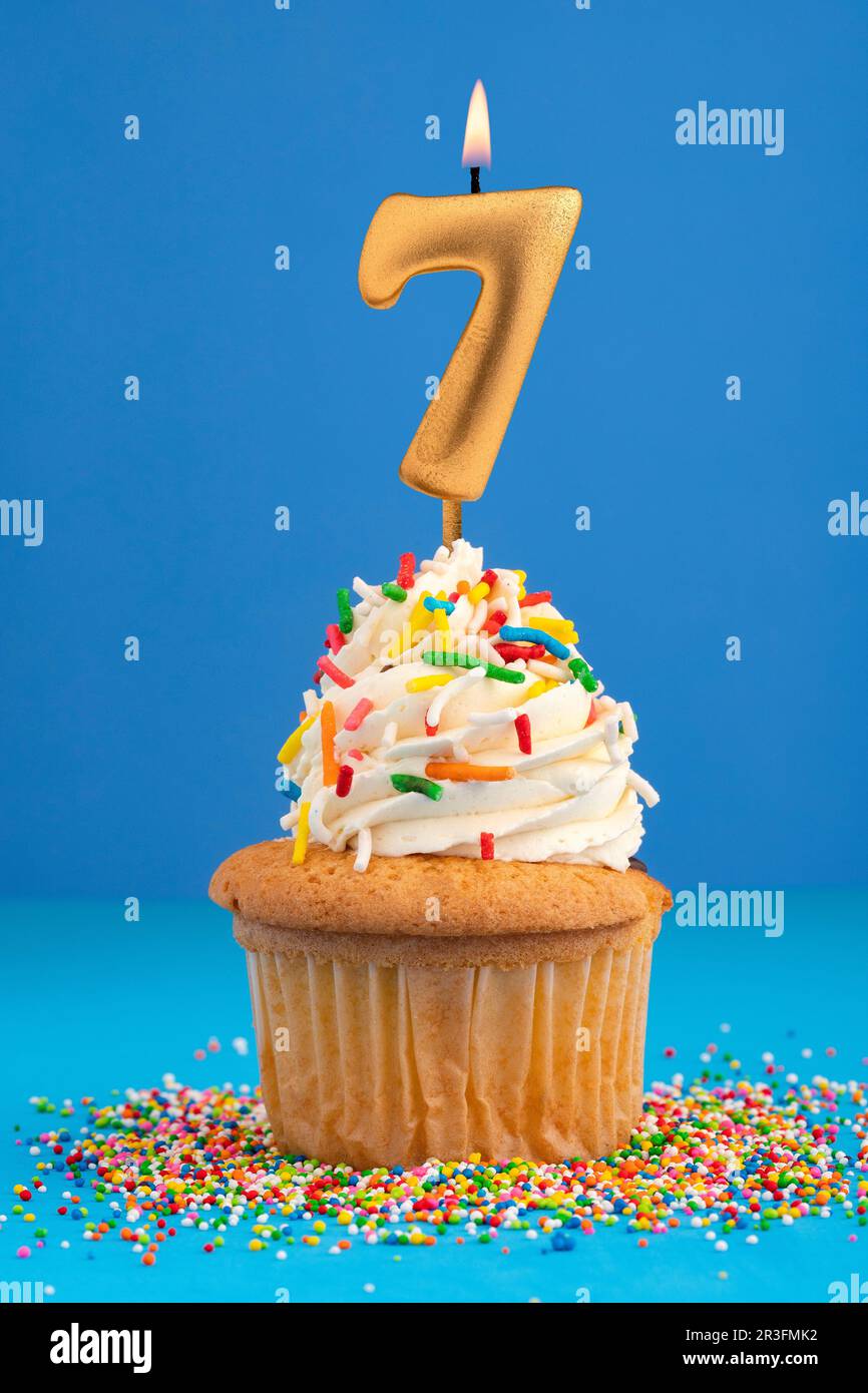 Candle number 7 Cake birthday in blue background Stock Photo Alamy