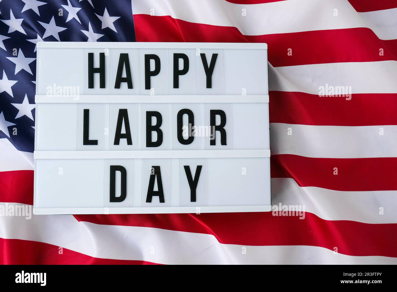 American flag. Lightbox with text HAPPY LABOR DAY Flag of the united states of America. July 4th Independence Day. USA patriotis Stock Photo