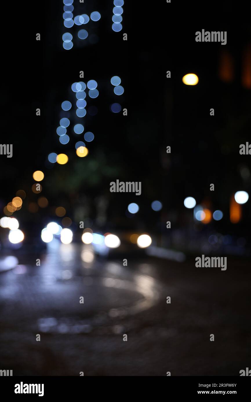 Blurred view of city street with lights at night. Bokeh effect Stock ...