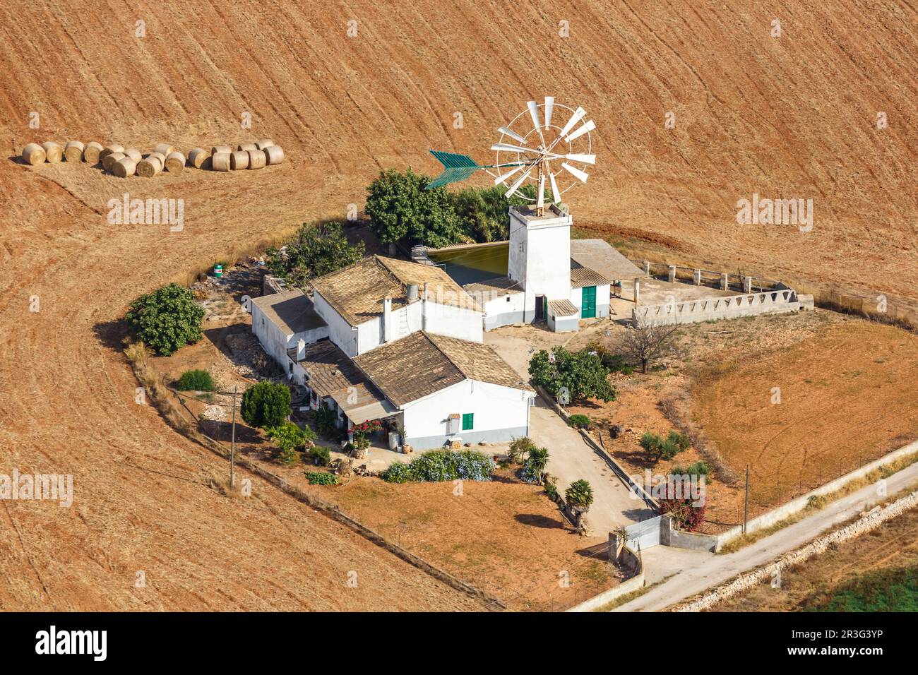 Traditional finca in Mallorca farm with windmill landscape aerial view in Spain Stock Photo