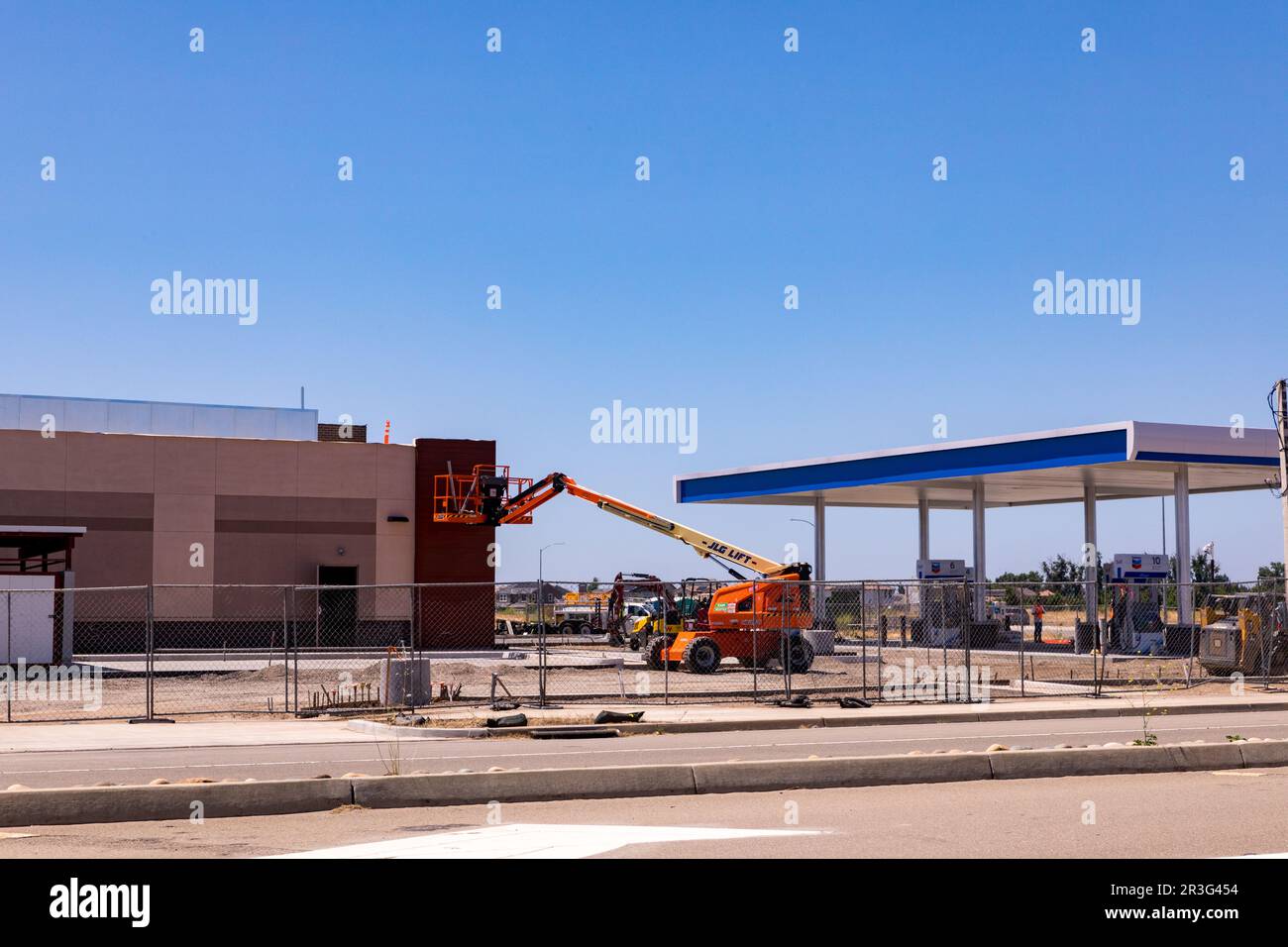 Construction crews work on a future Chevron gas station in Manteca California Stock Photo