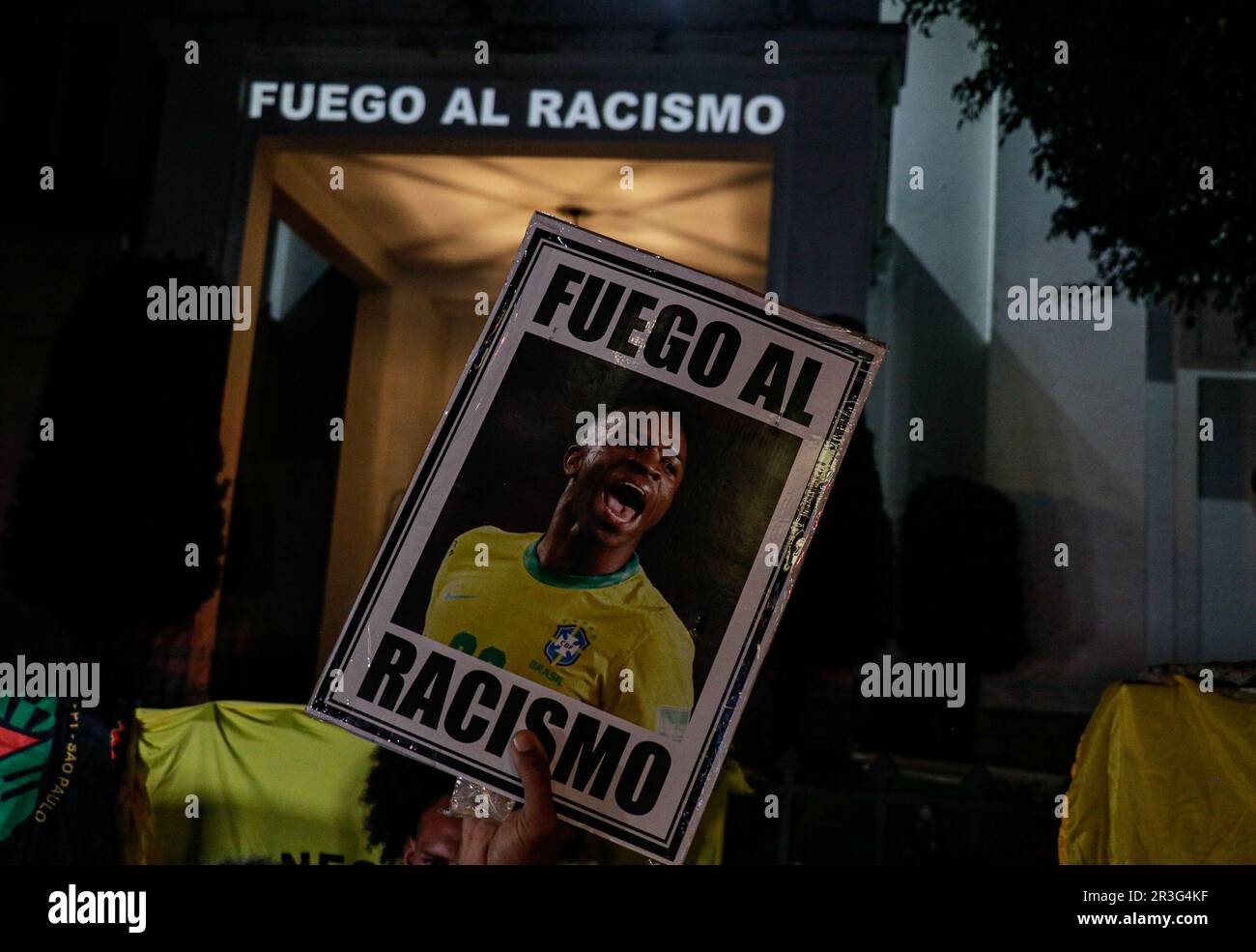 Sao Paulo, Brazil. 23rd May, 2023. Demonstrators from anti-racist social movements gather in front of the Spanish Consulate General holding a portrait of Vinicius Junior to protest the racist attacks on the Brazilian Real Madrid player. Credit: Allison Sales/dpa/Alamy Live News Stock Photo