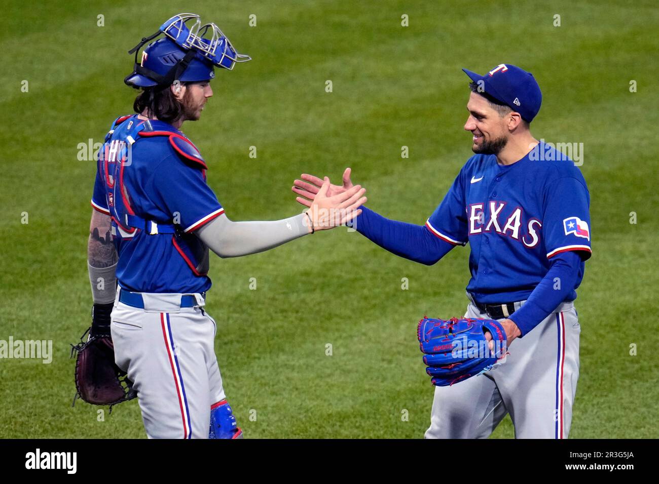 Texas Rangers starting pitcher Nathan Eovaldi, right, celebrates the