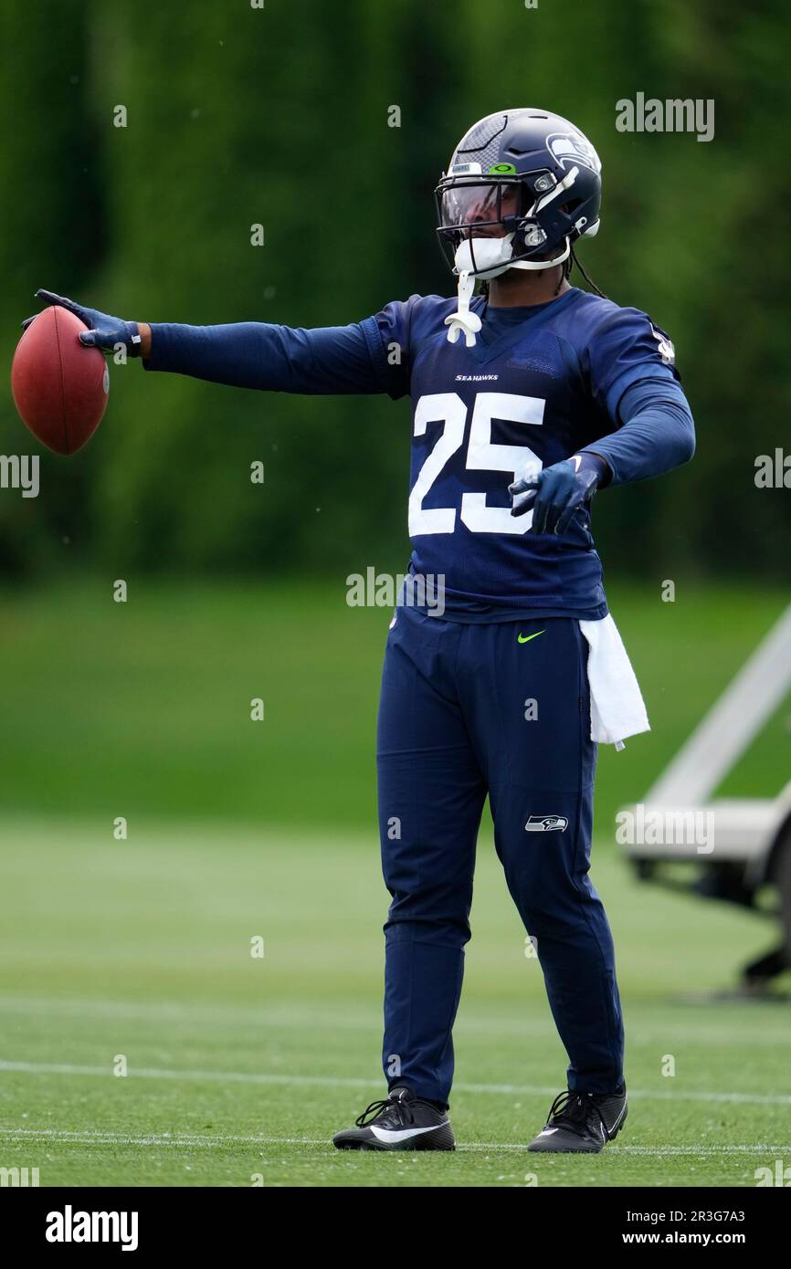 Seattle Seahawks running back Kenny McIntosh (25) holds a football