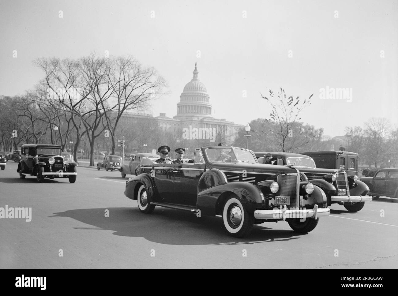 Cuban soldier Fulgencio Batista and Chief of Staff Malin Craig riding in a Cadillac as they pass the Capitol in Washington D.C. Stock Photo