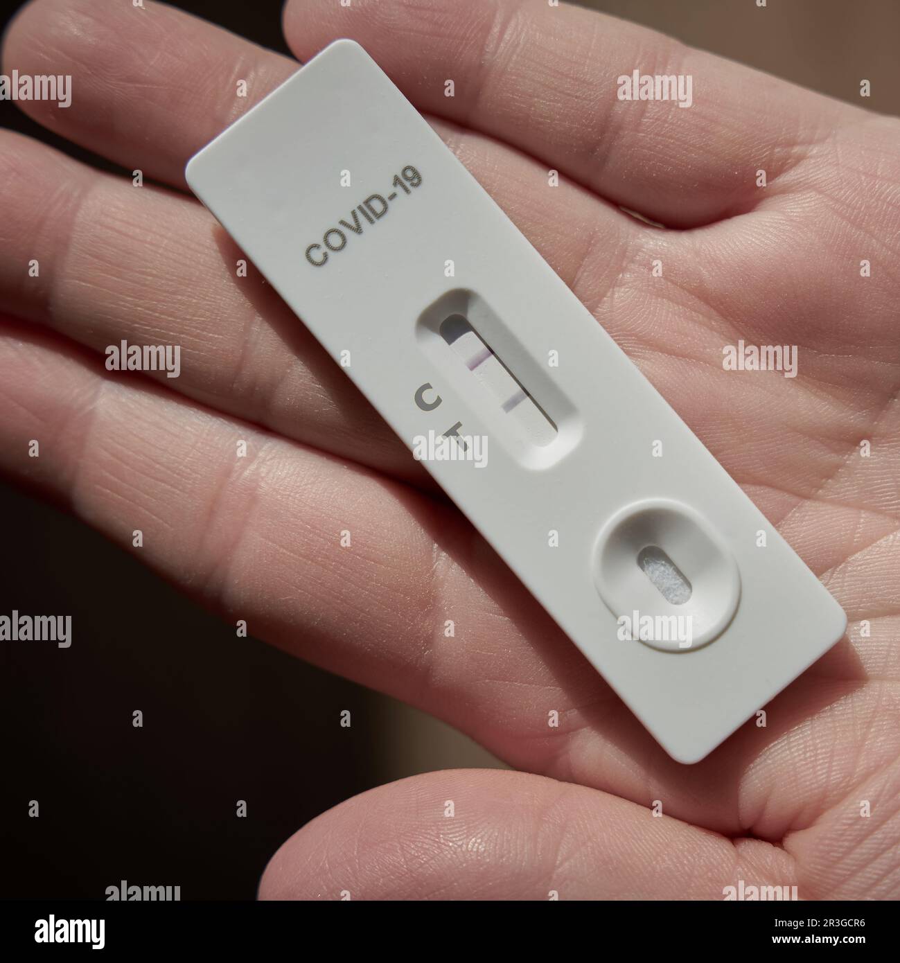 Self-conducted Corona antigen rapid test with a positive test result Stock Photo