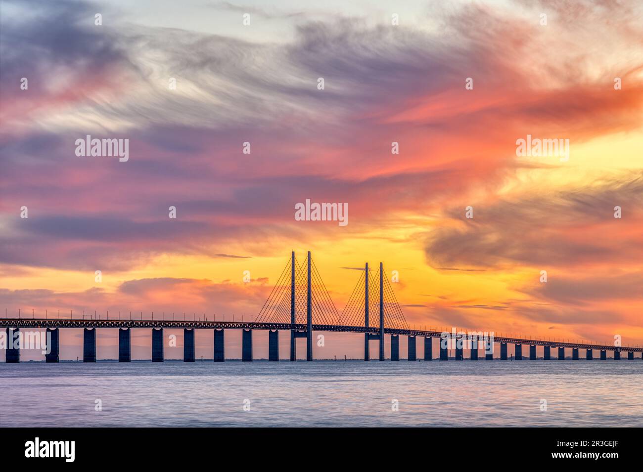 The Oresund bridge between Denmark and Sweden during a spectacular sunset Stock Photo