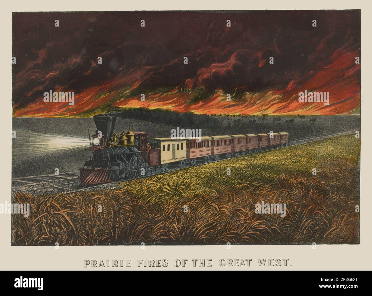 Train traveling across prairie ahead of fire, circa 1872. Stock Photo