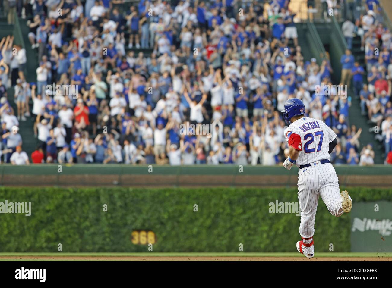 Chicago, US, May 23, 2023. Seiya Suzuki of the Chicago Cubs rounds the  bases after hitting a solo home run in the second inning of a baseball game  against the New York