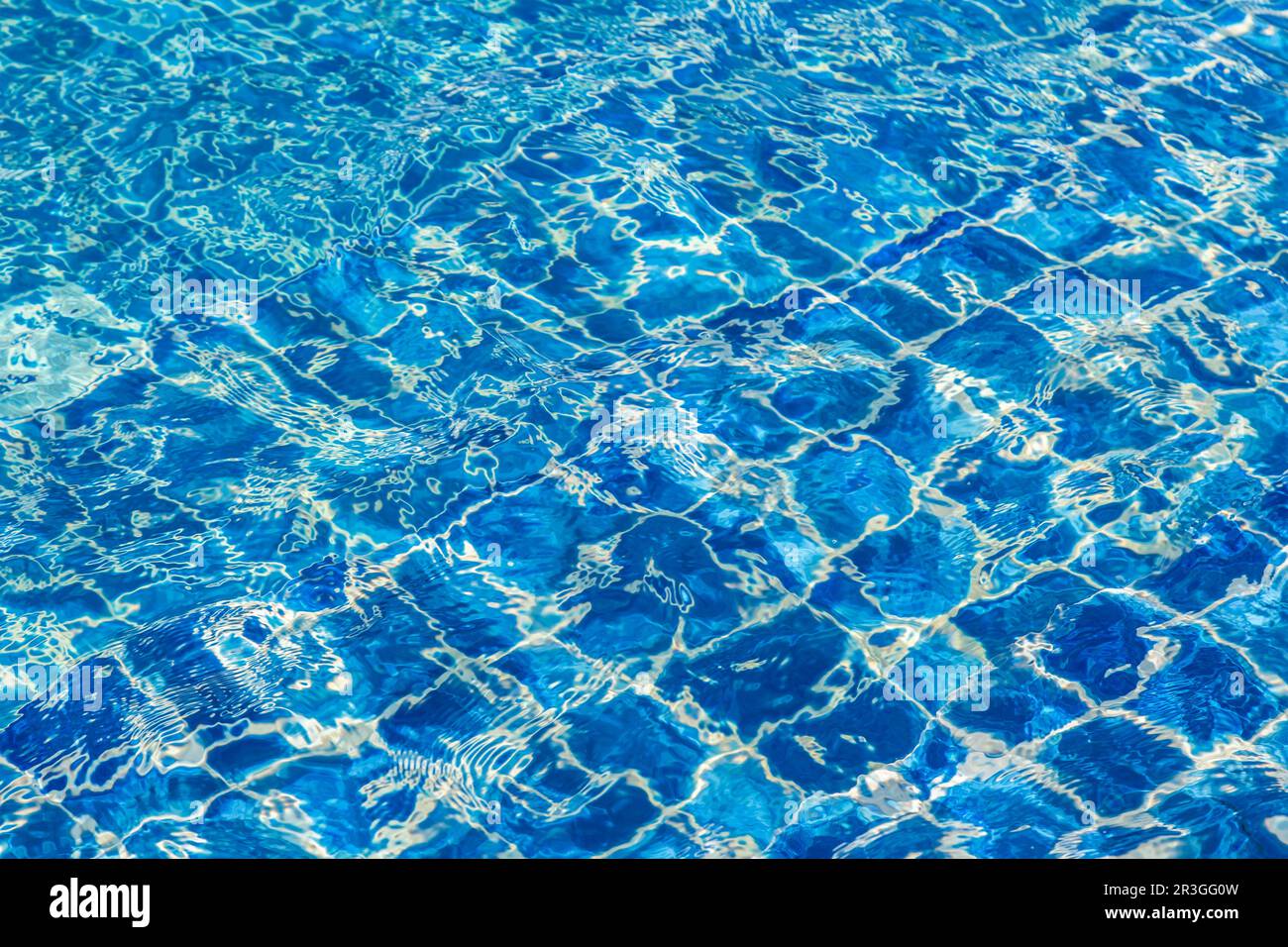 Blue color water in swimming pool rippled background Stock Photo