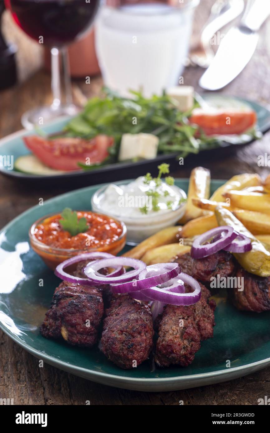 Greek bifteki with french fries Stock Photo