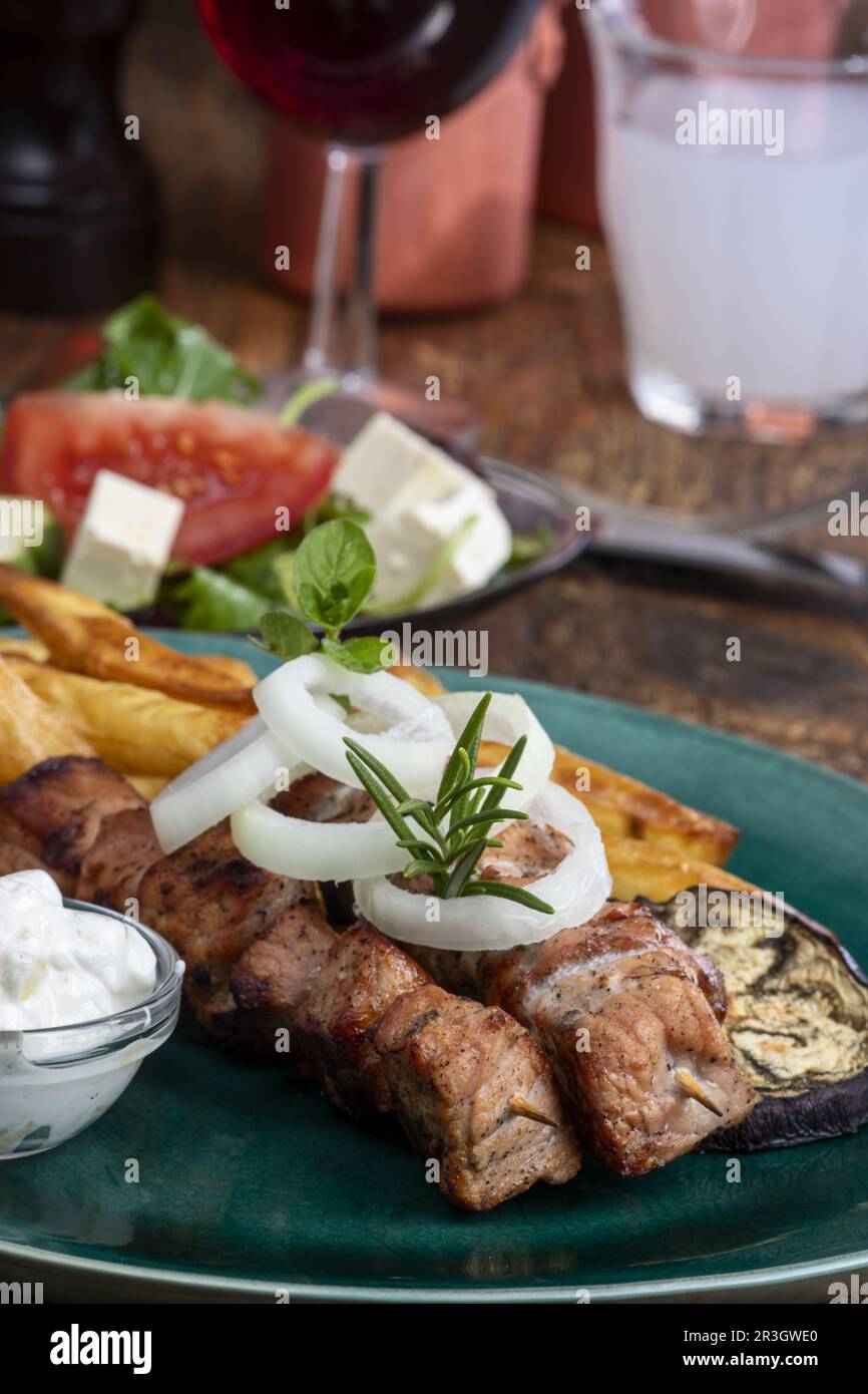 Greek souvlaki skewers with fries Stock Photo
