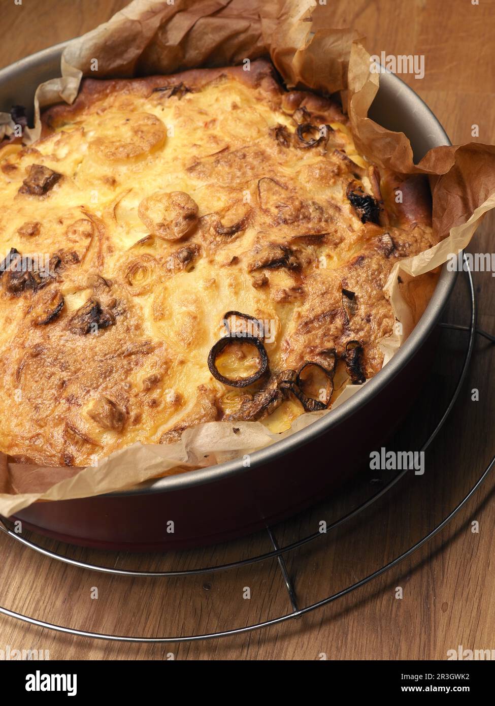 Quiche with potatoes and leeks in a springform pan, vegetarian food